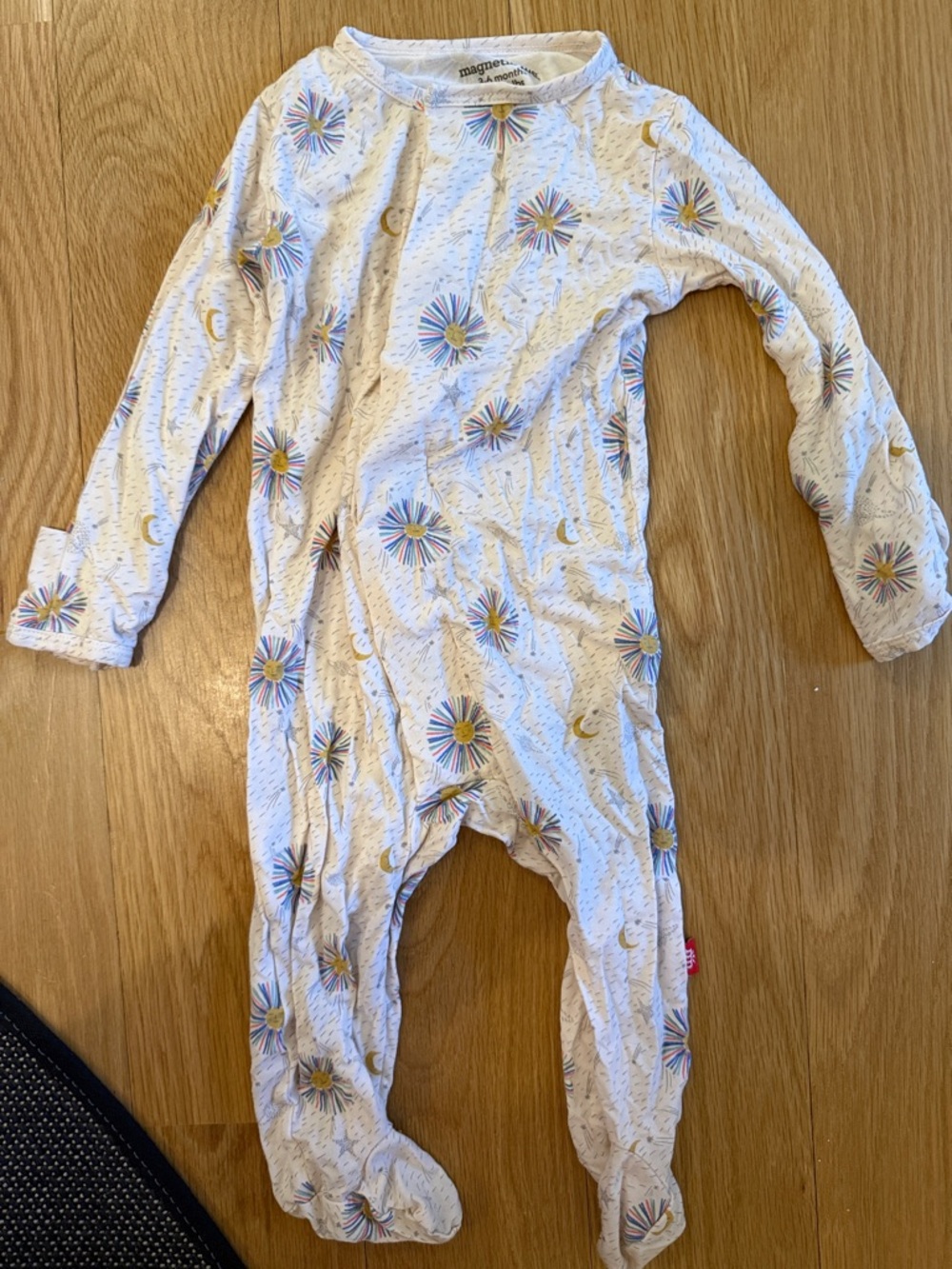 Magnetic Me White Footed One-Piece with Rainbow Starburst and Gold Moon Accents